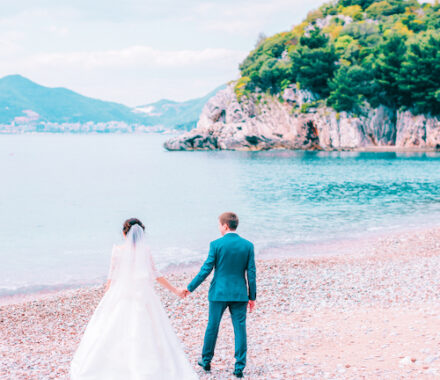 destination wedding couple travel. Wedding couple on beach. Montenegro. Milocer.