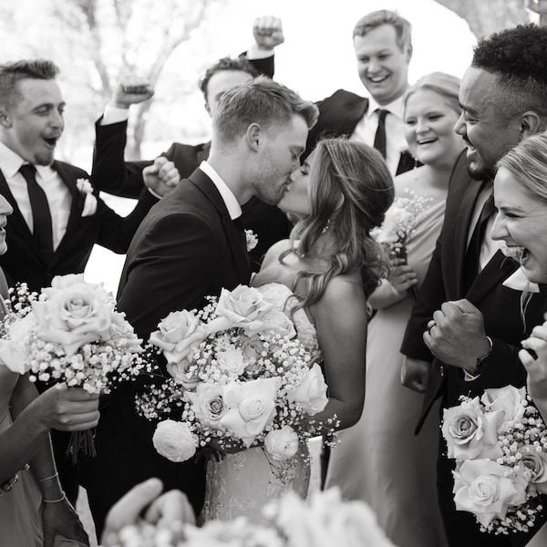 Lone Summit Ranch KC Wedding Venue WedKC Black and White Couple Kiss Bridal Party