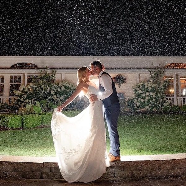 Lone Summit Ranch Kansas City Wedding Venue WedKC Couple Kiss Rain