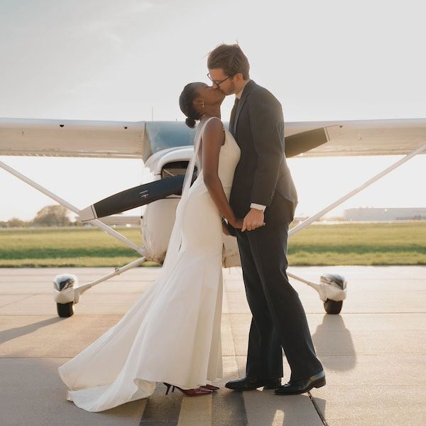 Nichole Storey Photography Kansas City Wedding Photographer WedKC Airplane Kiss Couple