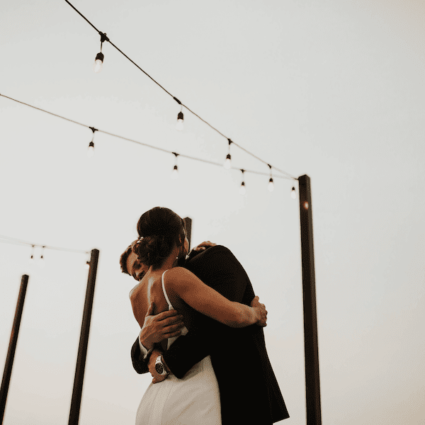The Abbott Kansas City Wedding Venue WedKC Couple Hug String Lights