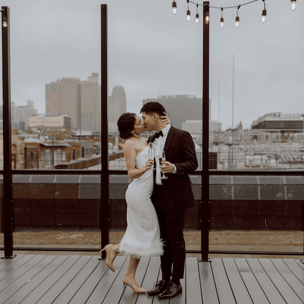 The Abbott Kansas City Wedding Venue WedKC Skyline Kiss