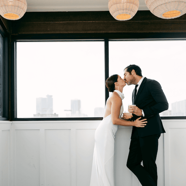 The Bardot Kansas City Wedding Venue WedKC Bride Groom Window Kiss