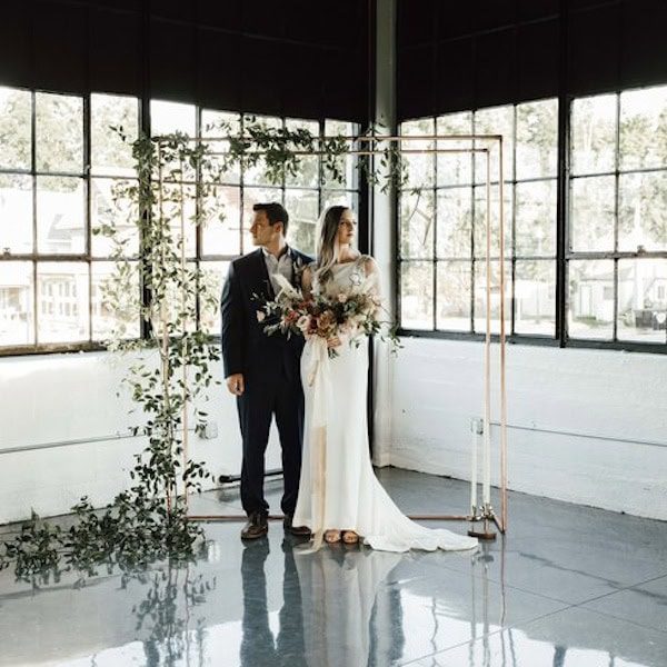 The Delaware Events Kansas City Wedding Venue WedKC Arch Bride Groom