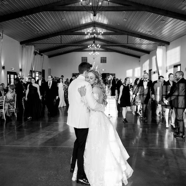 The-Vineyard-at-J-Creek-Kansas-City-Wedding-Venue-WedKC-Couple-First-Dance-Hug