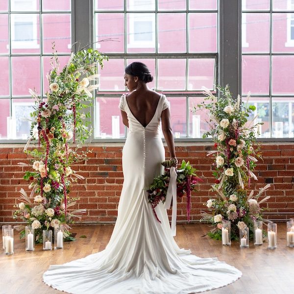 ThirtyOne-Thirty Events Kansas City Wedding Planner WedKC Bride Dress Back Floral Arrangement