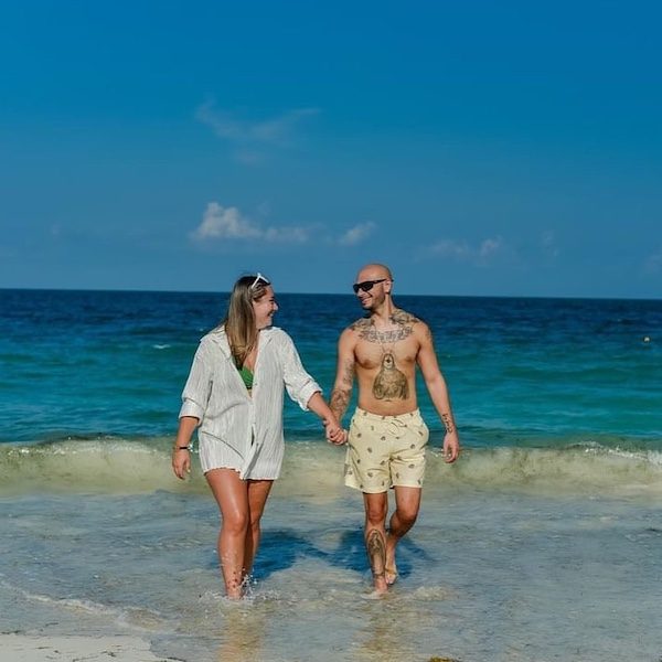 Those Who Wander Travel Kansas City WedKC Travel Specialist Couple Walking Beach