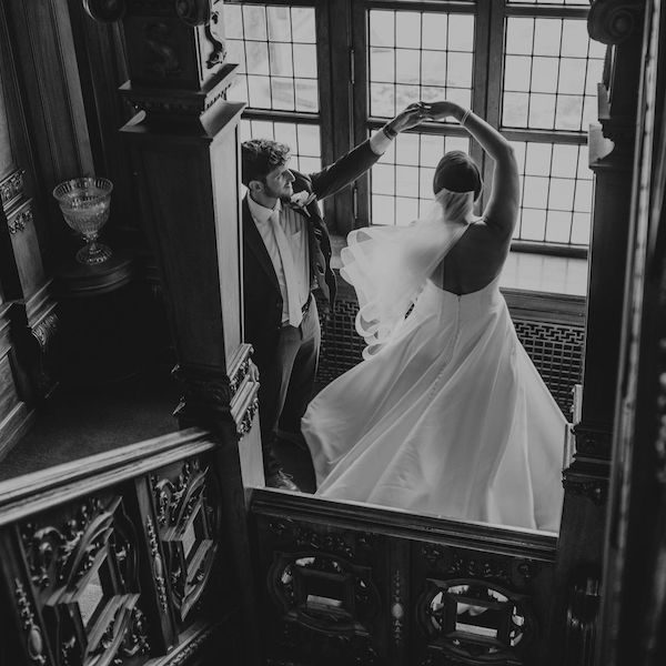 Timshel Studios Kansas City Wedding Photography WedKC Bride Groom Spin Stairs